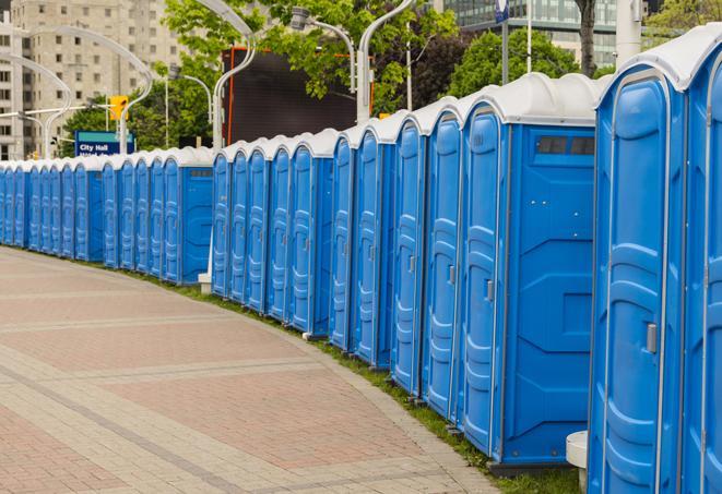 hygienic portable restrooms lined up at a beach party, ensuring guests have access to the necessary facilities while enjoying the sun and sand in Arcola TX